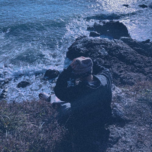 A tear trickled down from the corner of her eye